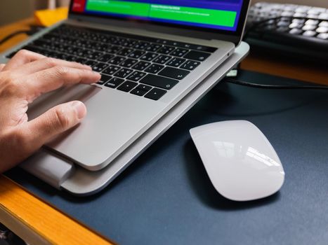 close up of mouse and laptop on the table