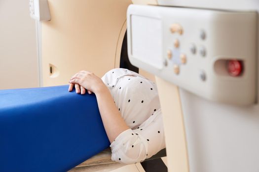 Female patient undergoing MRI - Magnetic resonance imaging in a Hospital. Medical Equipment and Health Care
