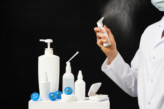 hand using sanitizer spray bottle against coronavirus.