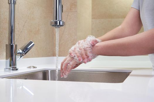 Woman washing hands with antibacterial soap for corona virus prevention, hygiene to stop spreading coronavirus covid19