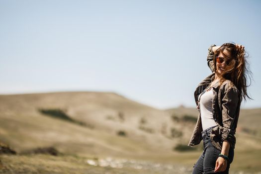 Shot of a smiling young woman enjoying the outdoors.