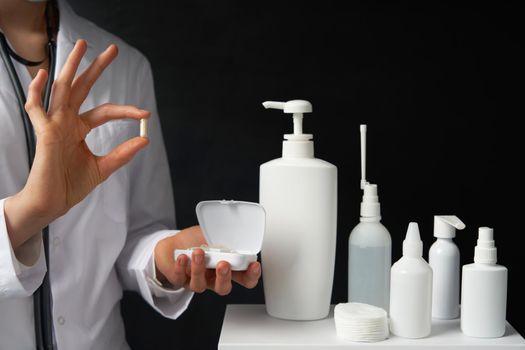 healthcare and medical concept - doctor with pill in hospital