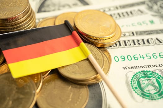 Stack of coins with USA Germany flag on white background.