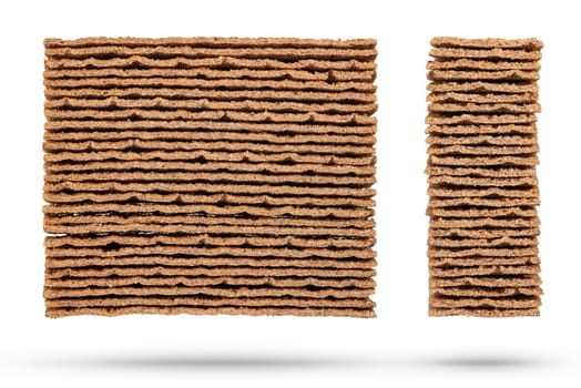 Texture of rye chips on a white background. The chips are stacked one on top of the other, close-up side view. Toasted slices of bread for sandwiches. High quality photo