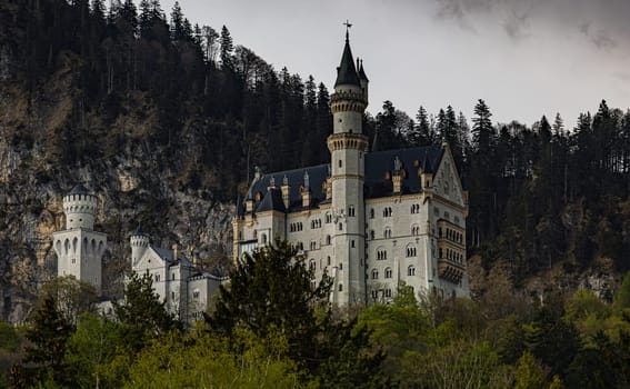 Neuschwanstein Castle in cloudy weather, Bavarian Alps, Germany, May 2023