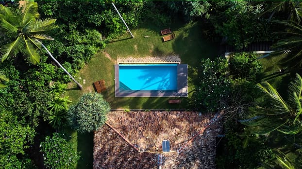 Aerial view of a villa with a swimming pool in the tropics. Hiriketiya beach, Sri Lanka. High quality photo