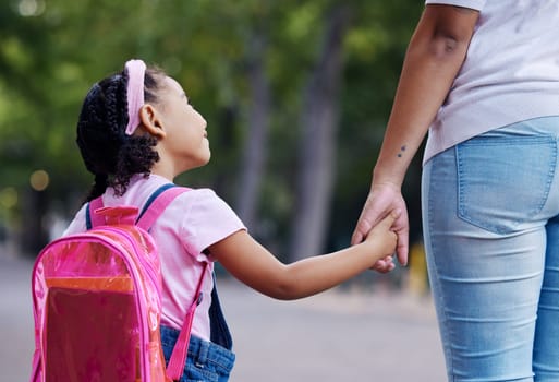 Back, mother and girl holding hands, school and education for learning, bonding or talking. Knowledge, mama or daughter walking, conversation or support for child development, kindergarten and care.
