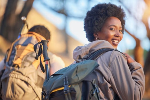 Hiking, fitness and travel with portrait of black woman on mountain for backpacking, adventure and explorer hobby. Travel, mountaineering, and nature with couple trekking in countryside for discovery.