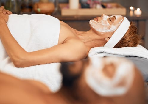 Couple, skincare and face mask in relax spa for luxury healthcare, wellness or self care on marriage anniversary holiday date. Black woman, facial and cleaning product in salon with zen or peace man.