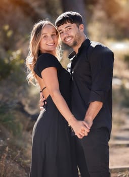 Portrait, love and real couple holding hands with smile in celebration for marriage commitment. Bonding, man and happy woman embrace with happiness, romance and trust on honeymoon vacation.