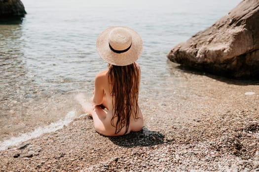 Woman travel sea. Happy tourist taking picture outdoors for memories. Woman traveler looks at the edge of the cliff on the sea bay of mountains, sharing travel adventure journey.