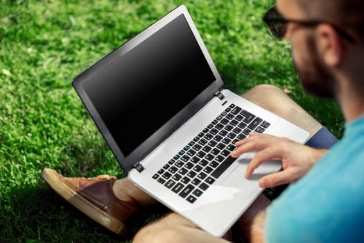 Top view male hands using notebook outdoors in urban setting while typing on keyboard, businessman freelancer working on computer while sitting on city park bench, tourist working on laptop, filter