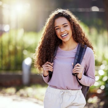 Woman with smile, backpack and student in campus garden, university with education and happy studying. Excited female person in outdoor portrait, academic scholarship and mockup space and college.