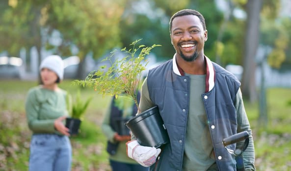 Agriculture, portrait and black man with a plant in nature after doing sustainable gardening in a park. Happy, smile and eco friendly African male gardener standing with greenery on an outdoor field