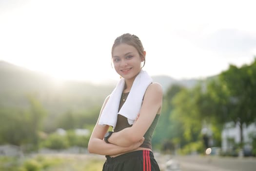 Portrait, young woman outdoor, exercise or fitness for wellness, health or smile. Asian female, girl and athlete rest, nature and workout for training, sports or practice to relax.