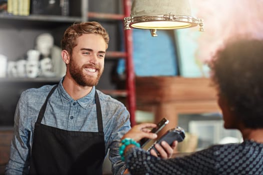 Man, barista and client with smartphone payment, cafe and transaction for services, smile and fintech. Female customer, male employee and happy guy at a coffee shop, small business and financial.
