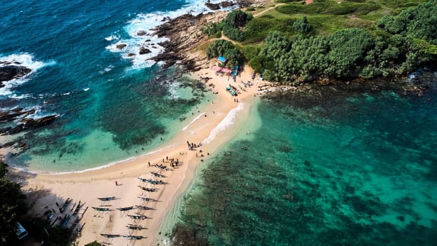 Aerial view of blue beach island. Drone view of the beaches of Sri Lanka. High quality photo