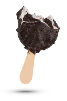 Chilled ice cream on a stick, on a white isolated background. Half ice cream with dark chocolate and cookies. To be inserted into a design or project. High quality photo