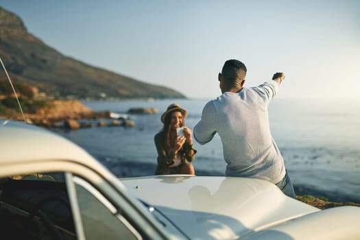 Be yourself because its enough. a young couple making a stop at the beach while out on a roadtrip