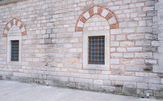 Window on a brick wall under brick arch