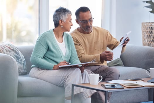 Finance, documents and senior couple on sofa with bills, paperwork and insurance checklist in home, life or asset management, Elderly black people on couch with financial, retirement or mortgage debt.