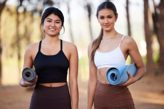 Portrait, yoga and fitness with woman friends in the forest for wellness, mental health or spiritual balance. Health, nature or diversity with a young female yogi and friend outdoor in the woods.