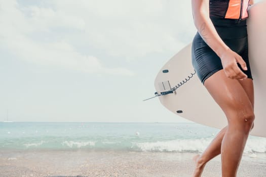 Woman man sea sup. Close up portrait of beautiful young caucasian woman with black hair and freckles looking at camera and smiling. Cute woman portrait in a pink bikini posing on sup board in the sea