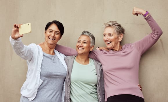 Senior women, phone selfie and strong fitness support together for arm exercise workout motivation, training wellness and retirement lifestyle. Elderly friends, smartphone and cardio care happiness.
