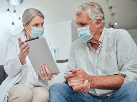 Tablet, face mask and doctor with senior patient speaking about test results during health consultation. Medical, mobile and healthcare worker consulting elderly man with covid at clinic in Australia.