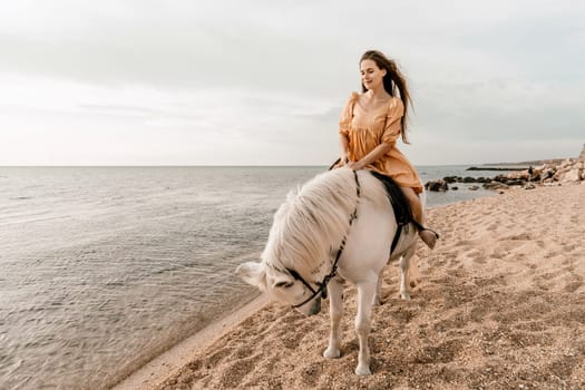 A white horse and a woman in a dress stand on a beach, with the sky and sea creating a picturesque backdrop for the scene