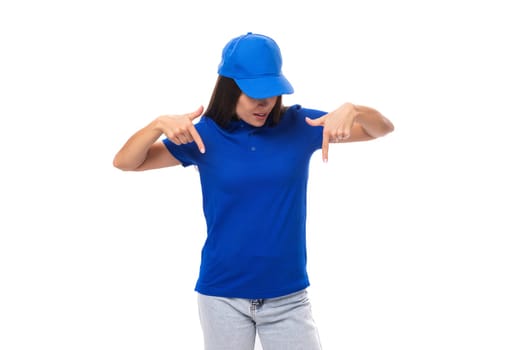 well-groomed pretty young caucasian brunette woman in uniform t-shirt and cap with mockup for print.