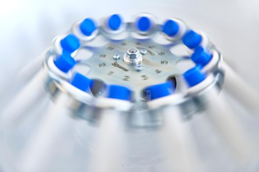 Blood test tubes in centrifuge. Plasma preparation in medical.