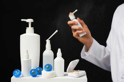 hand using sanitizer spray bottle against coronavirus.