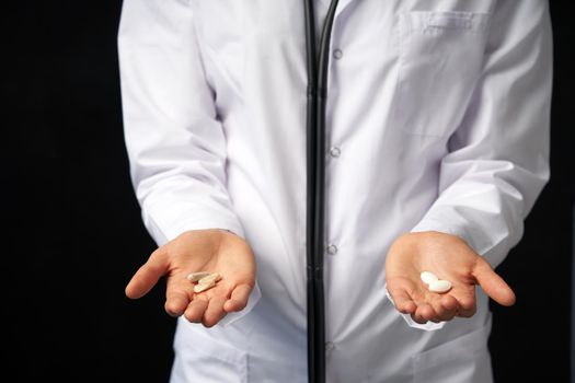Doctor Hands with Pills. Difficult Choice between drugs. Placebo drugs concept. Healthcare concept.
