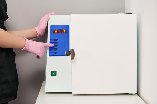 Sterilizing box. Sterilization of instruments and tools. Sterilization procedure. Steam autoclave.