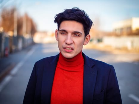 Hlaf body Shot of a Handsome Young Man Showing Disgusted Face Expression, Standing in the Street