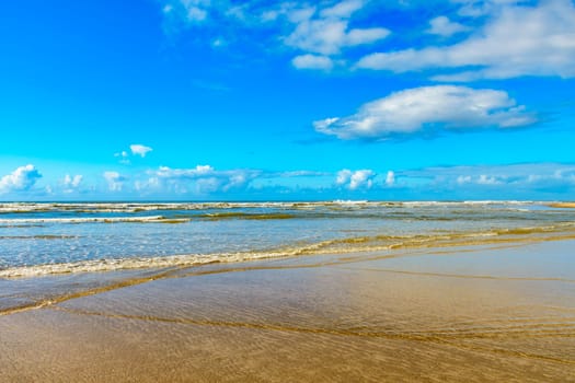 Quiet and deserted beach with small waves and clear waters in Serra Grande on the coast of Bahia