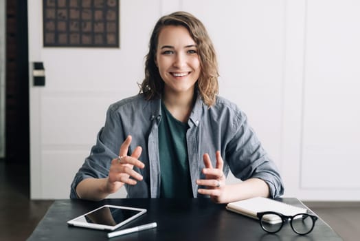 Confident Businesswoman Engaging in a Video Conference, Communicating through Web Camera from Office or Home. Professional and Modern Business Communication Concept