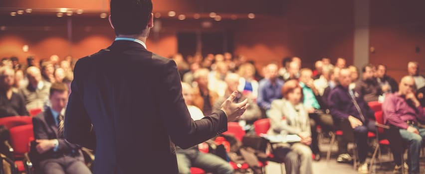 Speaker at Business Conference and Presentation. Audience at the conference hall.