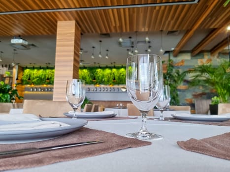 Empty glasses set in restaurant. Part of interior