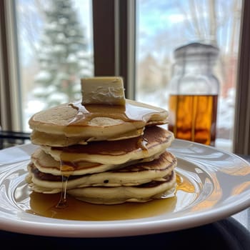 Pancakes with honey and butter on a white plate - selective focus (ID: 001410)