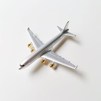 Airplane model on white background - top view - travel concept (ID: 001472)