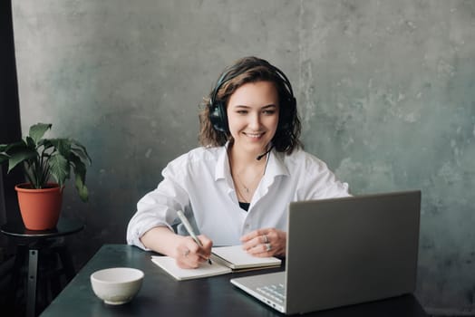 Empowering Distance Learning: Woman Engaged in E-Learning with Laptop at Home. Student's Productive Environment for Work or Study from Home, Business, Creativity, and Online Meetings