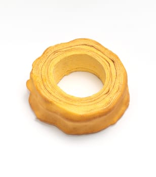 Isolated baumkuchen, Sakotis ,sekacz pie, traditional spit egg cake on white background. Flatly, copy space, horizontal plane