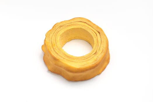 Isolated baumkuchen, Sakotis ,sekacz pie, traditional spit cake in lithuanian, polish, german, belarusian cuisine on white background Horizontal plane. Copy space, top view.