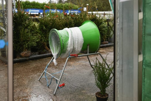 A Christmas tree packed in plastic net