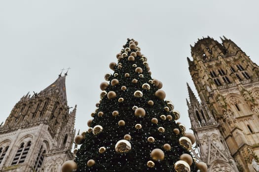 Decorated Christmas tree and cathedral at Rouen