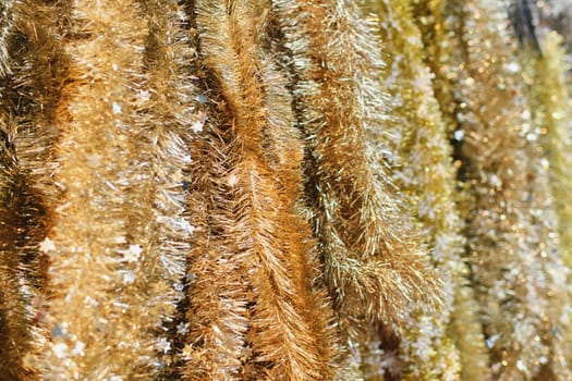 Golden tinsel for decoratin a Christmas tree
