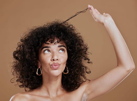 Hair care, black woman and hairstyle health texture of a model holding afro to show salon results. Beauty, skincare and natural skin glow of a young woman think about cosmetic wellness and hair style.