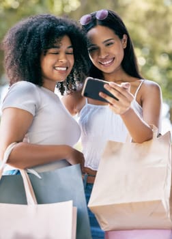 Phone selfie, retail bag and shopping friends post memory picture, gift present or discount sales purchase to social media app. Mobile tech, commerce service or African customer girl on fashion spree.